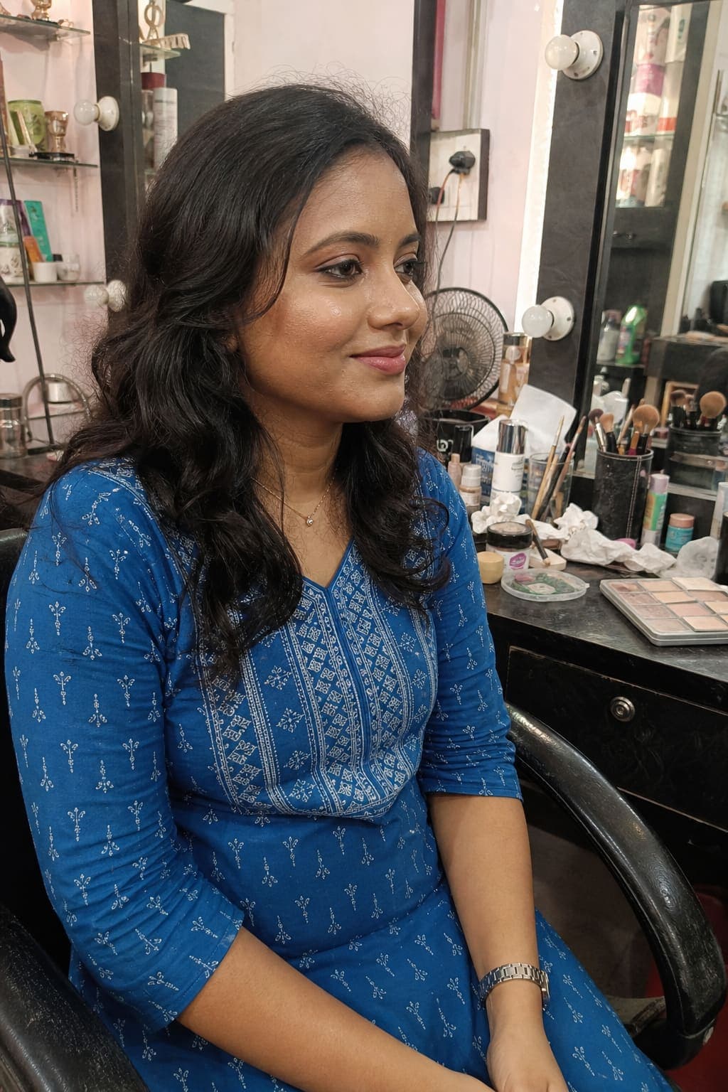 Soft glam party makeup with loose waves